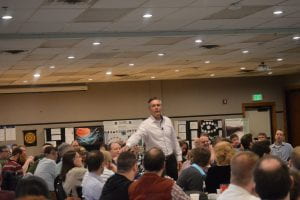 Photo of Kirk Weisler presenting to the group at the US:IT Summit.